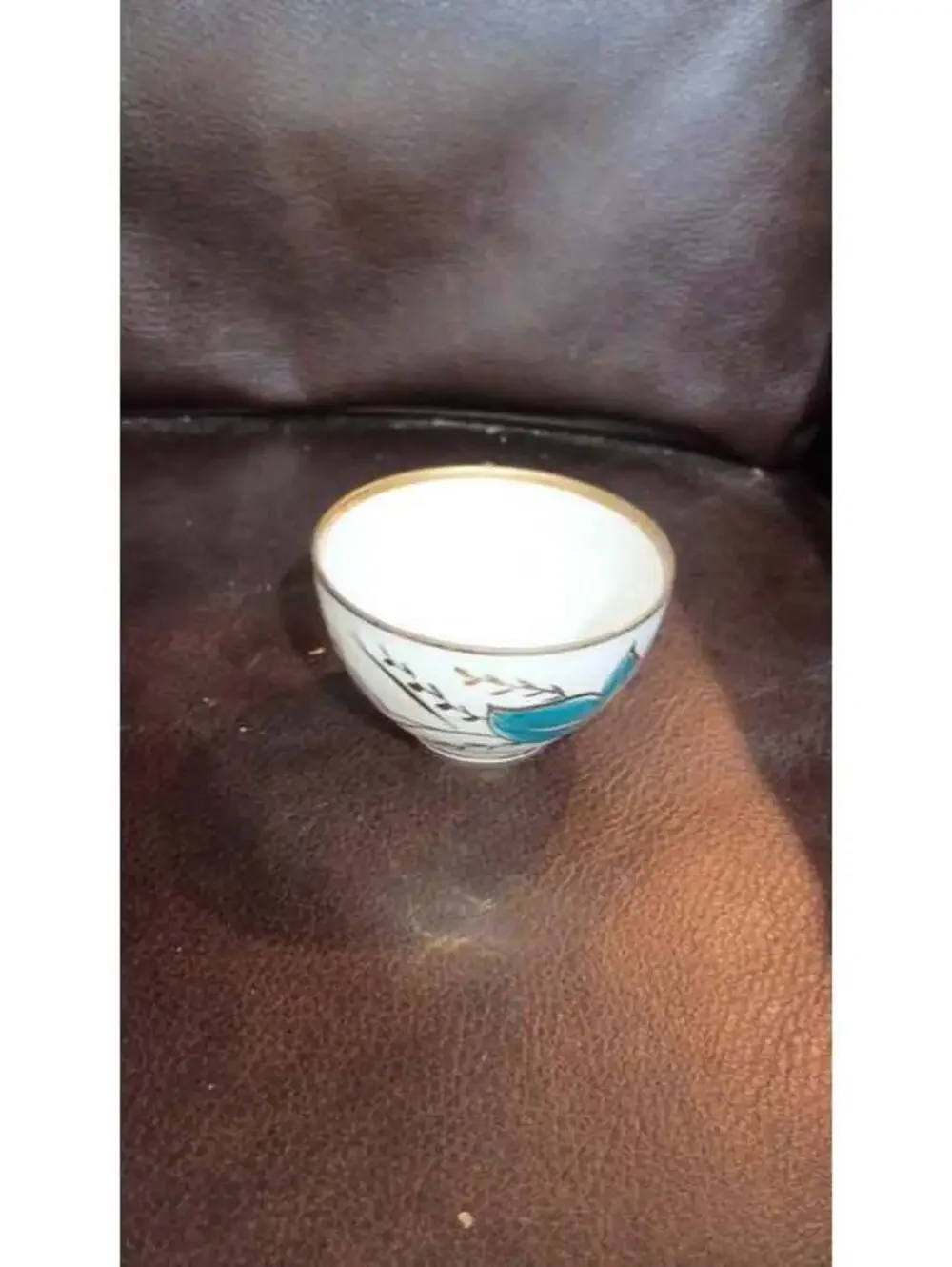 Vintage Ceramic Teacup with Blue Floral Design and Gold Trim